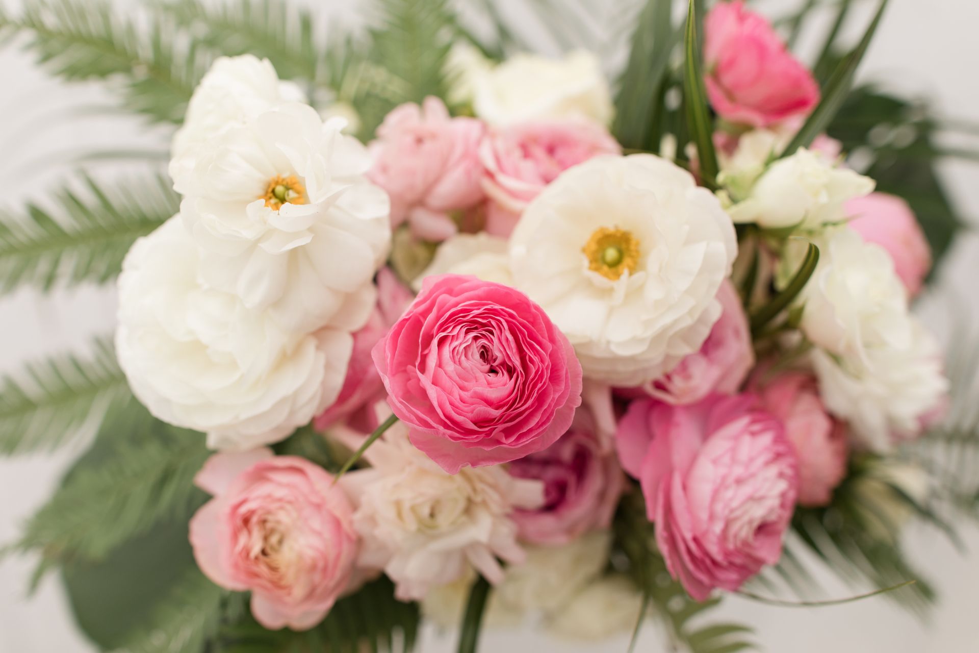 Top 3 Flowers For Every Wedding Season & Choosing The Right Ones - A Guide by Moana Nursery blog image with woman carrying seasonal flower wedding bouquet